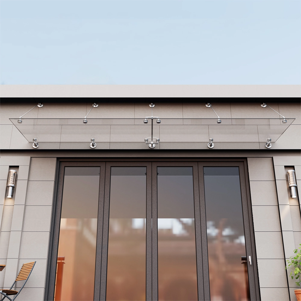 A frameless glass door canopy on stainless-steel fittings, mounted above aluminium bifold doors